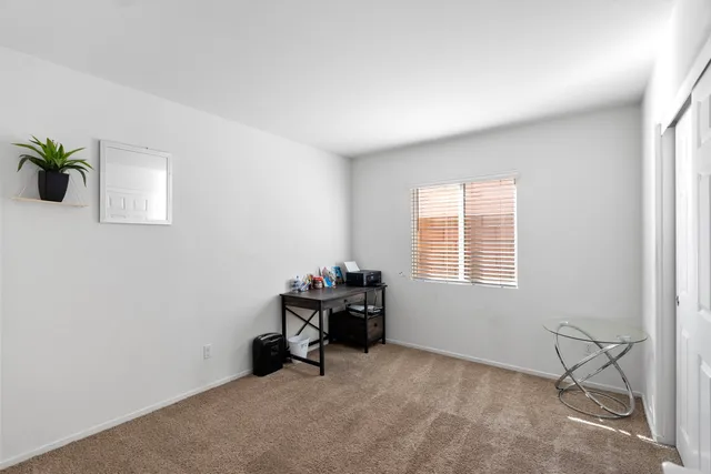 a room with workspace and a window