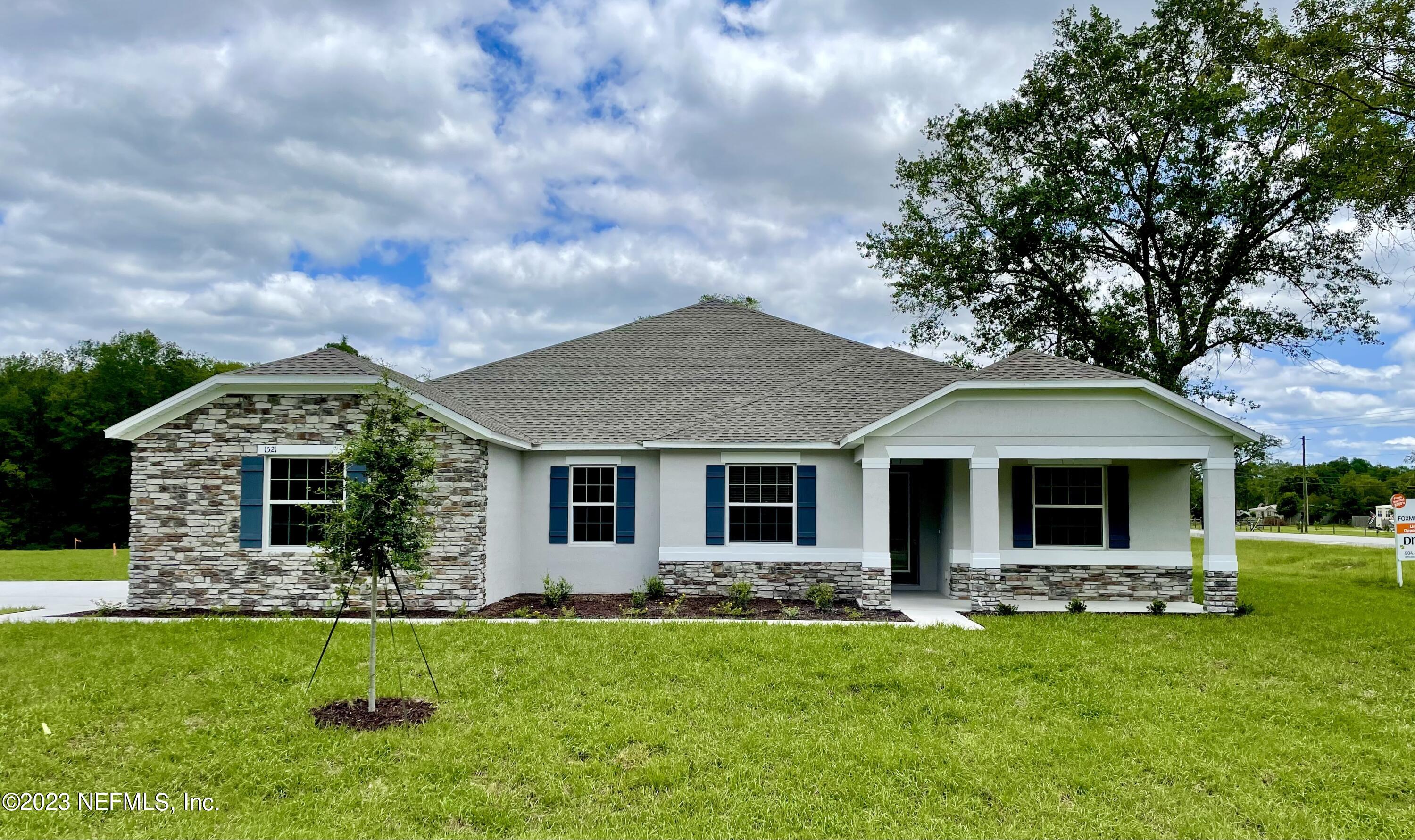 1521 Lake Foxmeadow Road Middleburg, FL 32068 - Photo 1 of 25 a front view of house with yard and green space