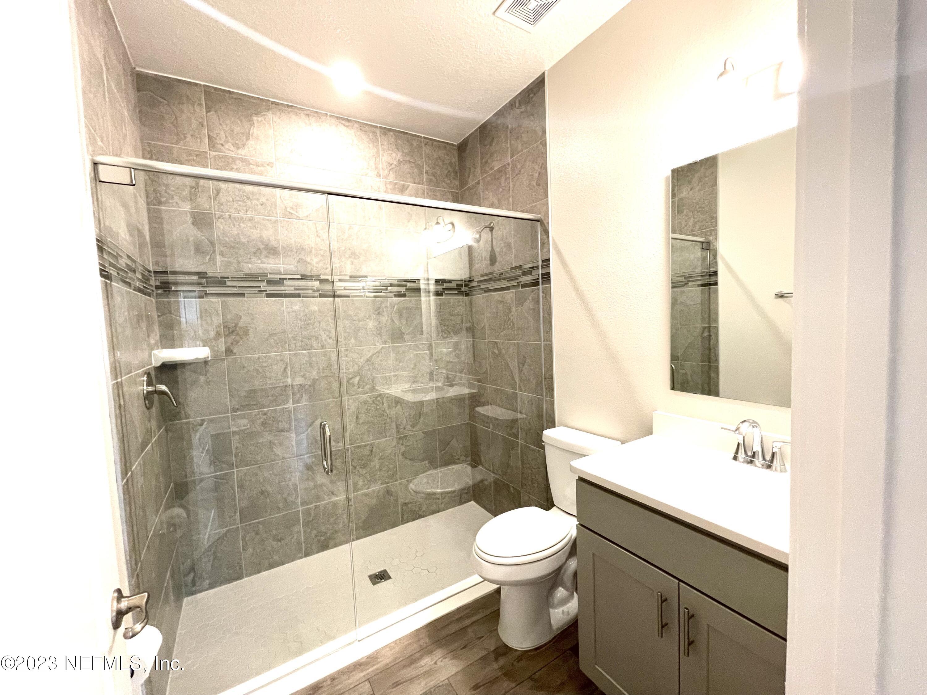 1521 Lake Foxmeadow Road Middleburg, FL 32068 - Photo 16 of 25 a bathroom with a shower toilet and sink