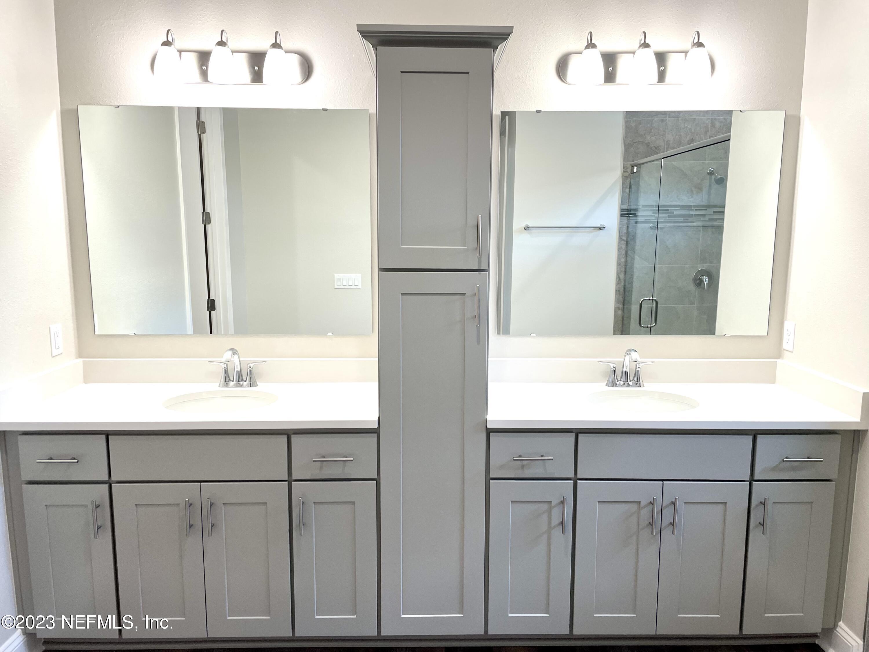 1521 Lake Foxmeadow Road Middleburg, FL 32068 - Photo 18 of 25 a bathroom with a sink and a mirror