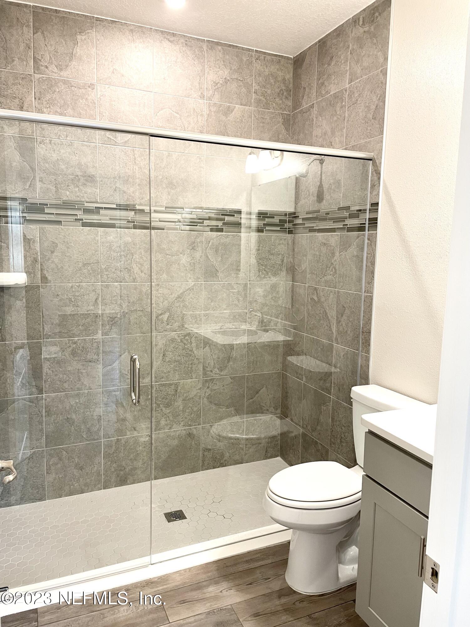 1521 Lake Foxmeadow Road Middleburg, FL 32068 - Photo 21 of 25 a bathroom with a shower and a toilet
