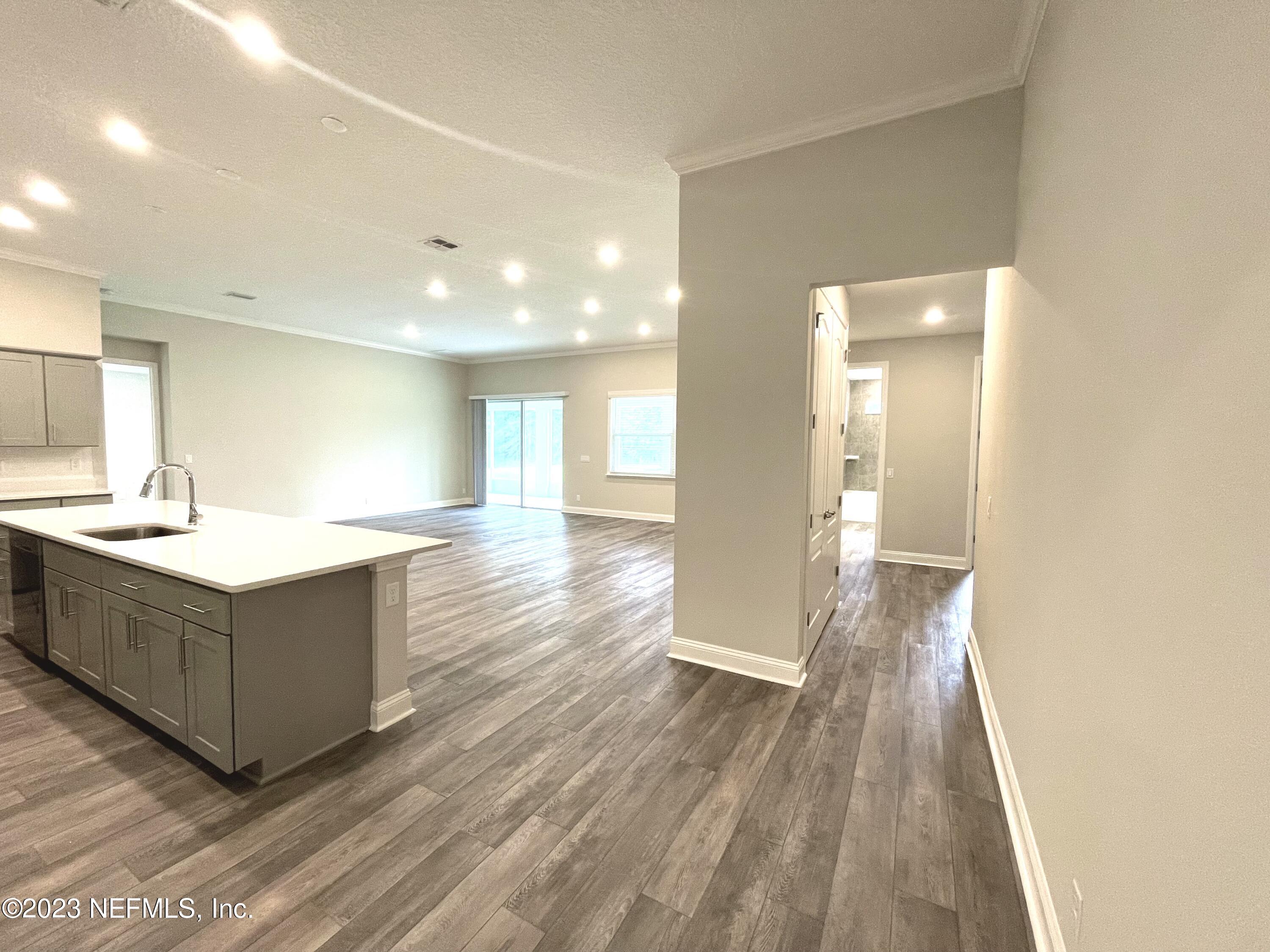 1521 Lake Foxmeadow Road Middleburg, FL 32068 - Photo 4 of 25 a large bathroom with a sink and a mirror