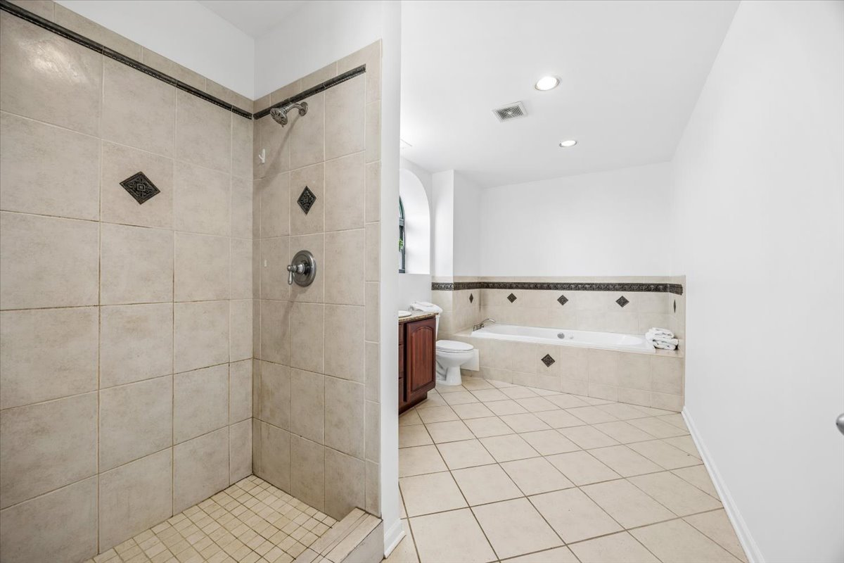 2363 East 70th Street, Unit 1 Chicago, IL 60649 - Photo 21 of 26 a bathroom with a bathtub and a shower