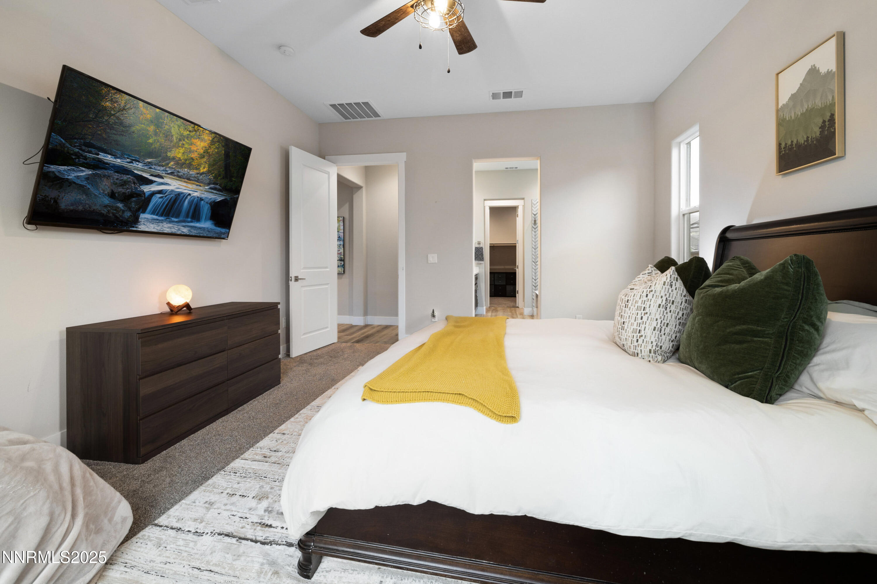 250 Commodore Drive Verdi, NV 89439 - Photo 15 of 43 a bedroom with a bed and a flat screen tv