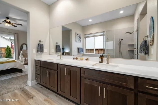 a spacious bathroom with a double vanity sink and a mirror