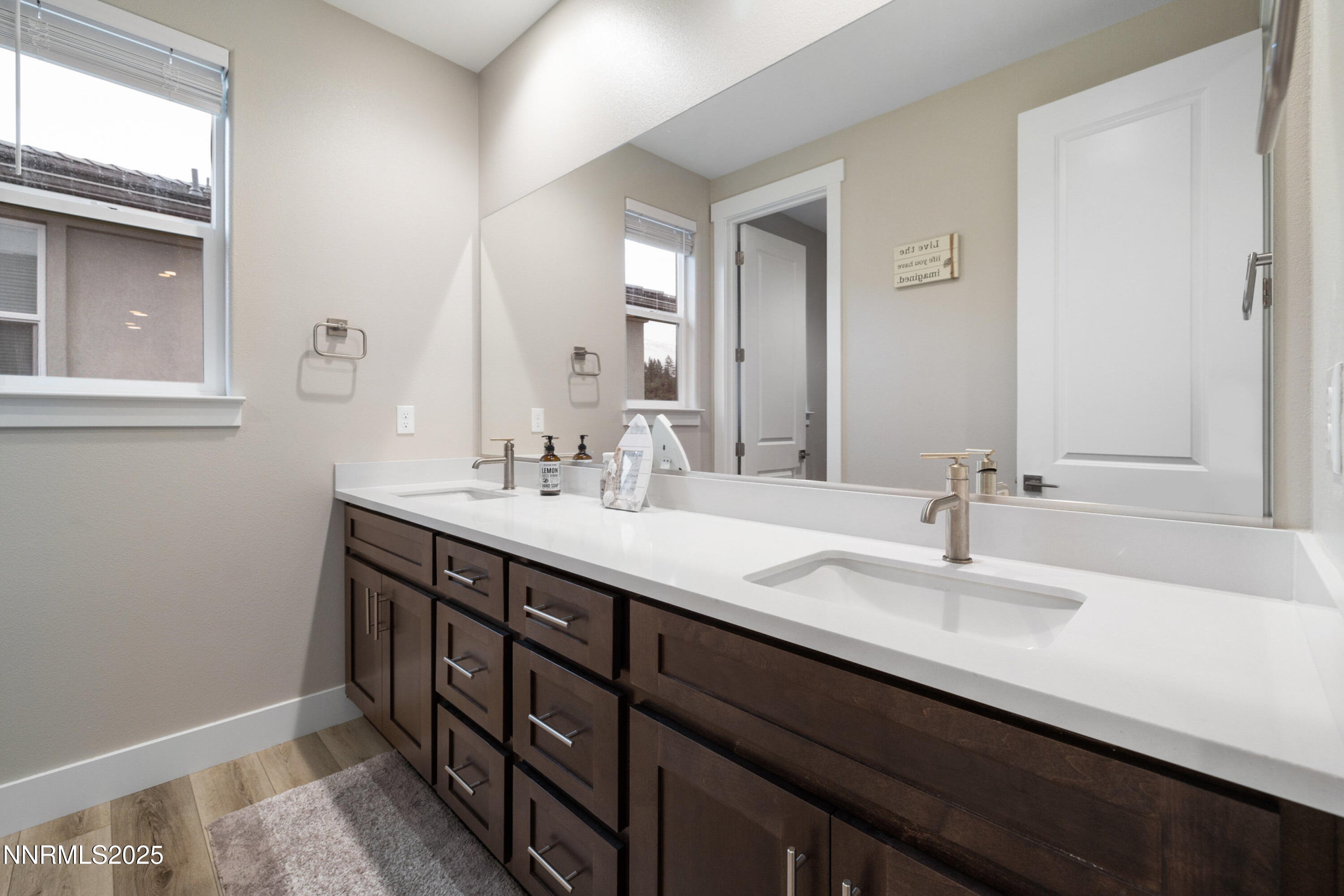 250 Commodore Drive Verdi, NV 89439 - Photo 22 of 43 a bathroom with a double vanity sink and a mirror