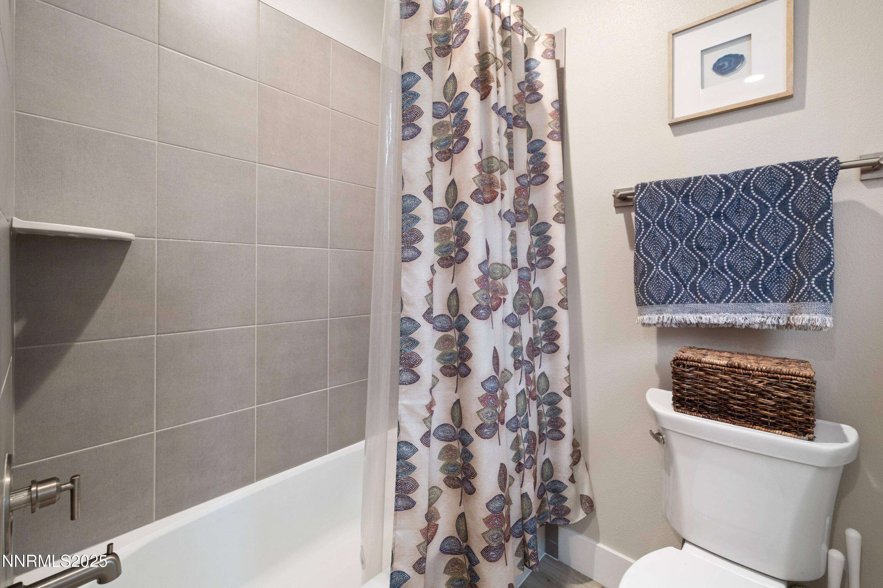 250 Commodore Drive Verdi, NV 89439 - Photo 23 of 43 a bathroom with a toilet and a shower curtain