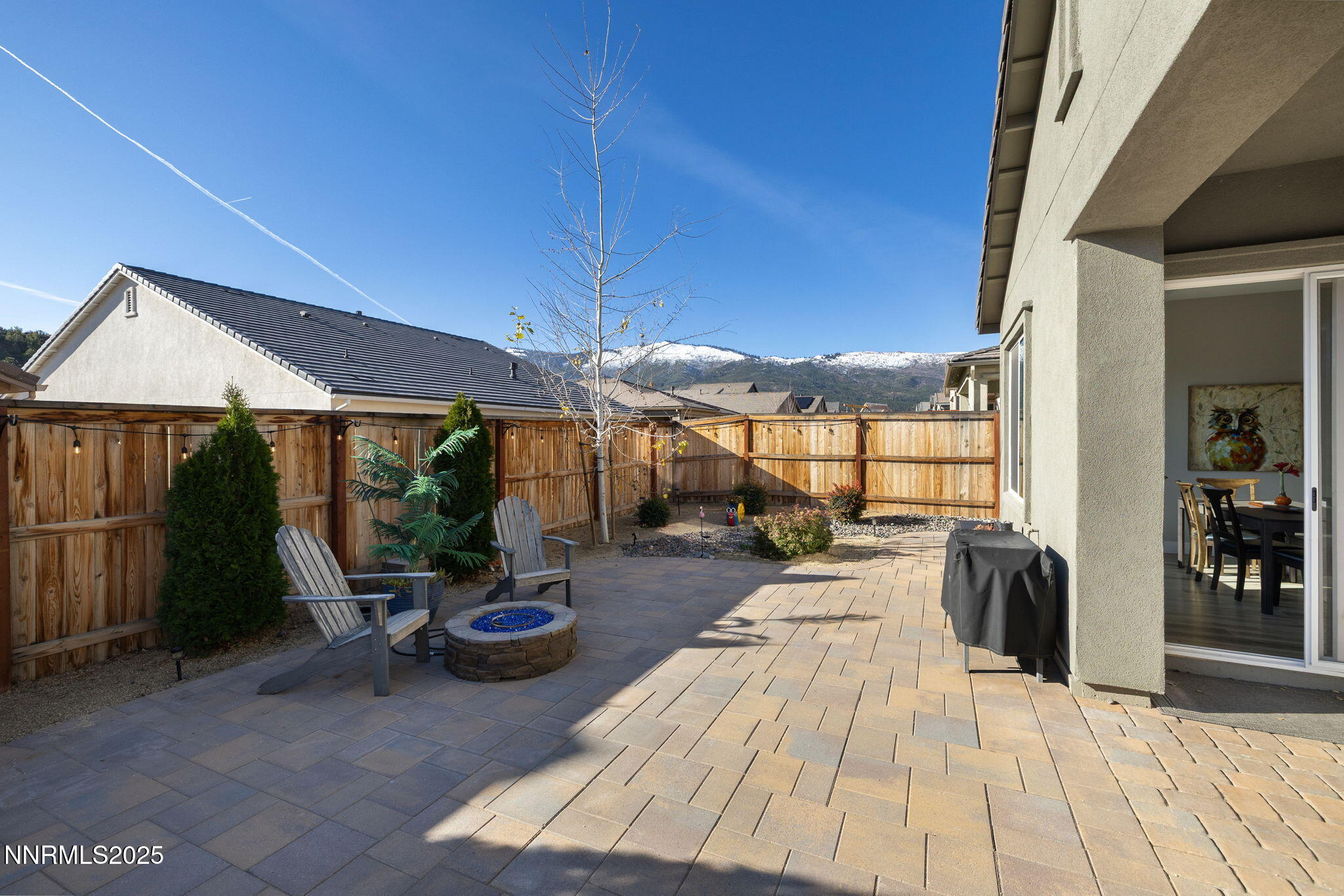 250 Commodore Drive Verdi, NV 89439 - Photo 38 of 43 a view of a patio with couches and table and chairs under an umbrella