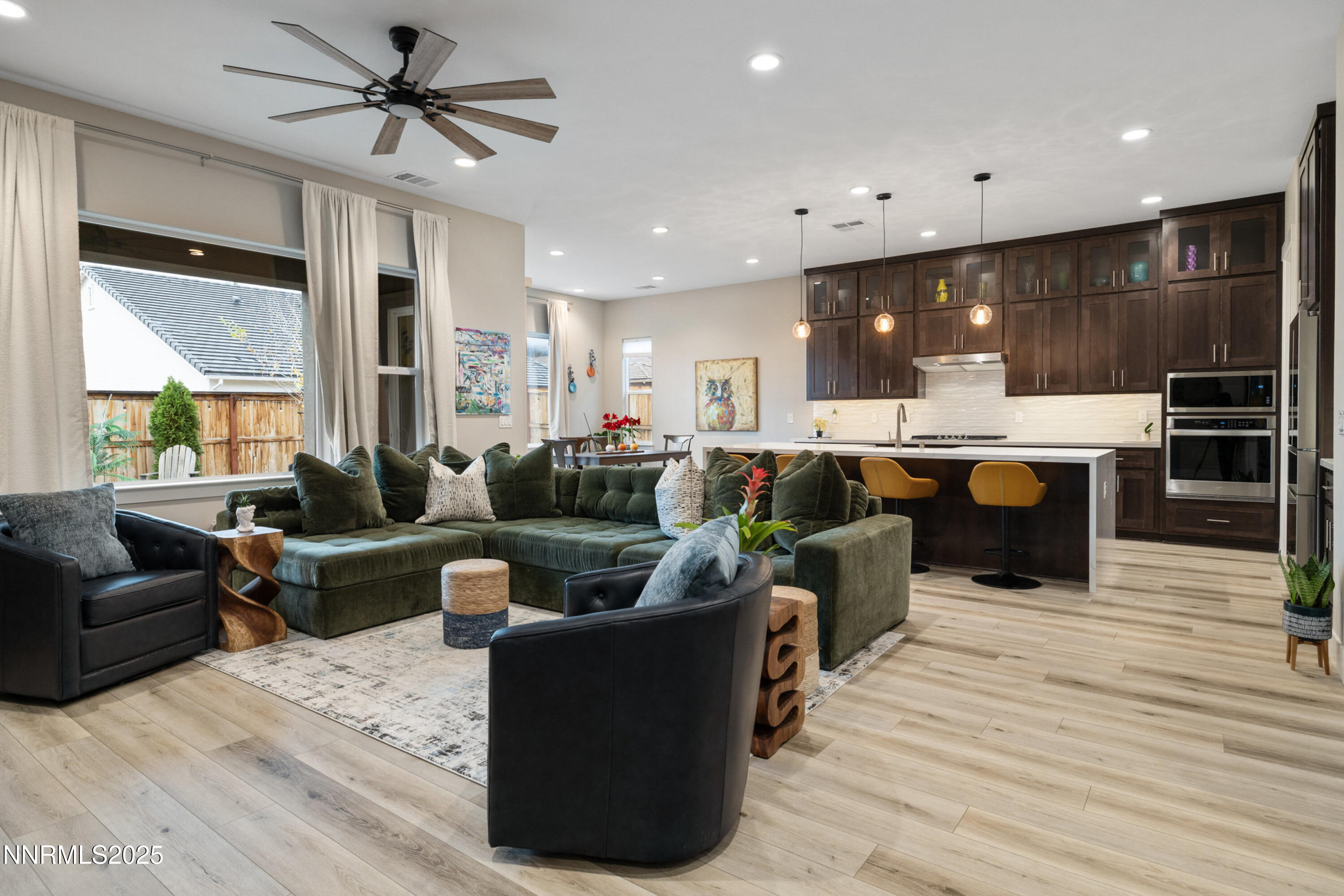 250 Commodore Drive Verdi, NV 89439 - Photo 4 of 43 a living room with furniture a wooden floor and chandelier