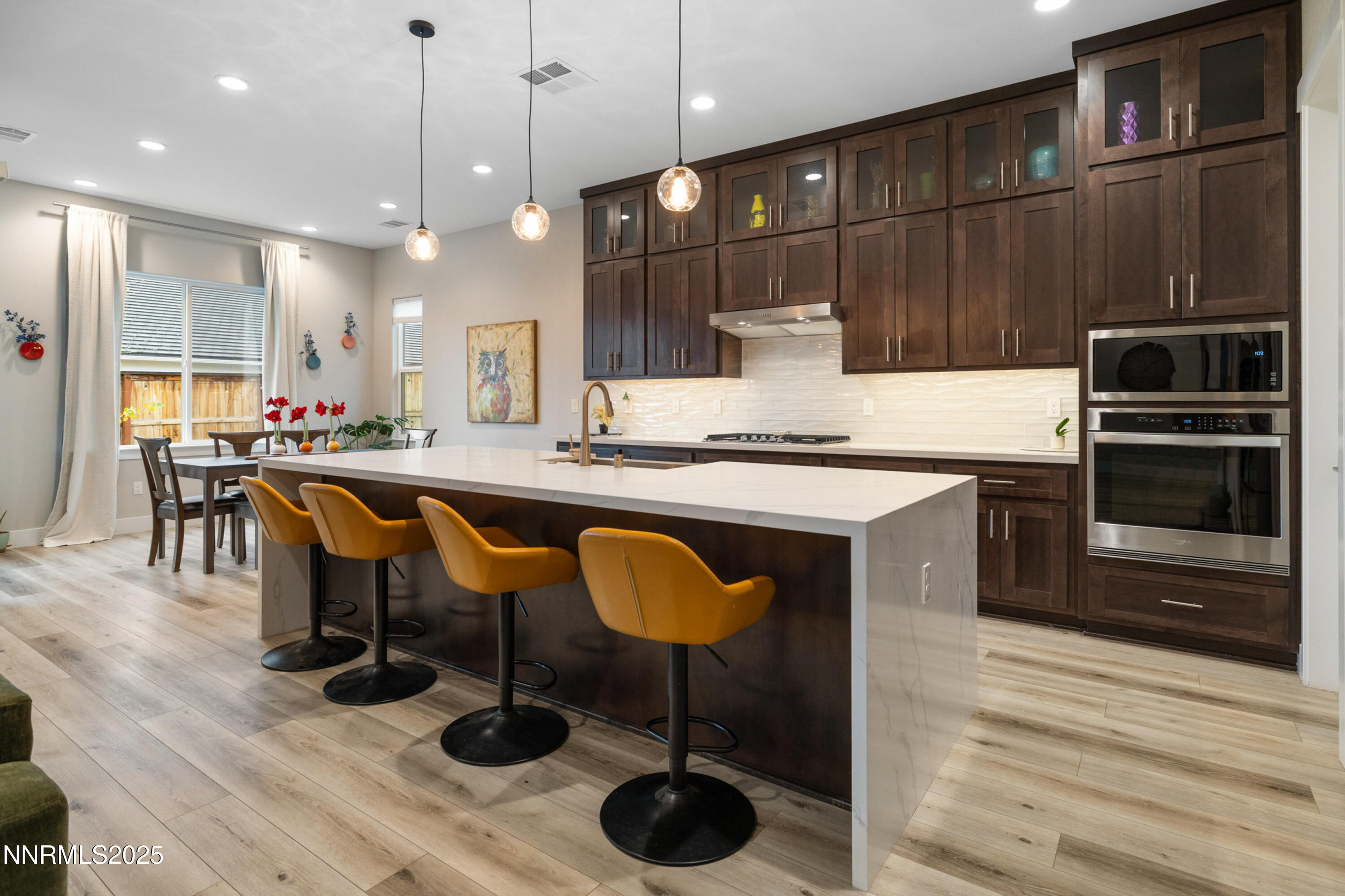 250 Commodore Drive Verdi, NV 89439 - Photo 5 of 43 a kitchen with stainless steel appliances granite countertop a sink a stove and a wooden floors