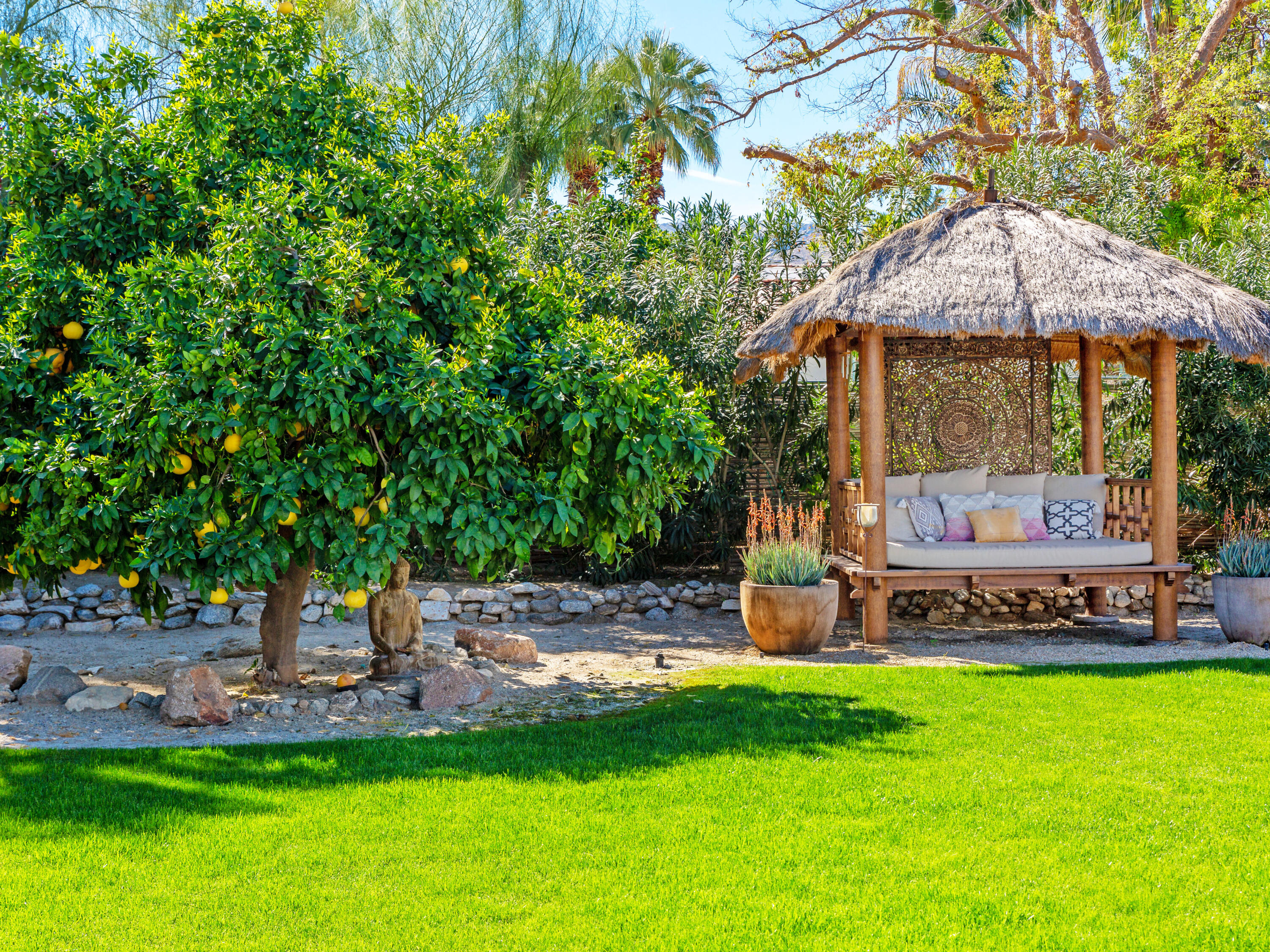 71607 Sahara Road Rancho Mirage, CA 92270 - Photo 13 of 63 a view of a house with backyard and sitting area