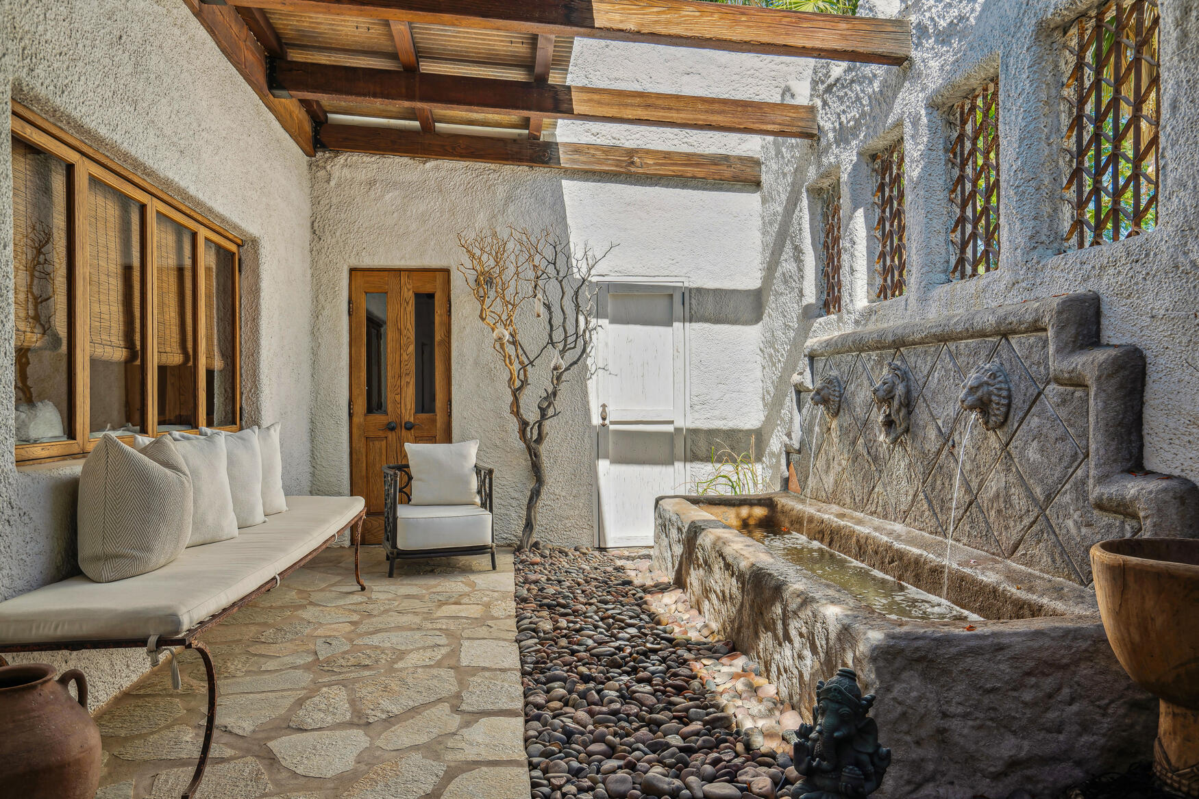 71607 Sahara Road Rancho Mirage, CA 92270 - Photo 15 of 63 a living room with furniture and a floor to ceiling window