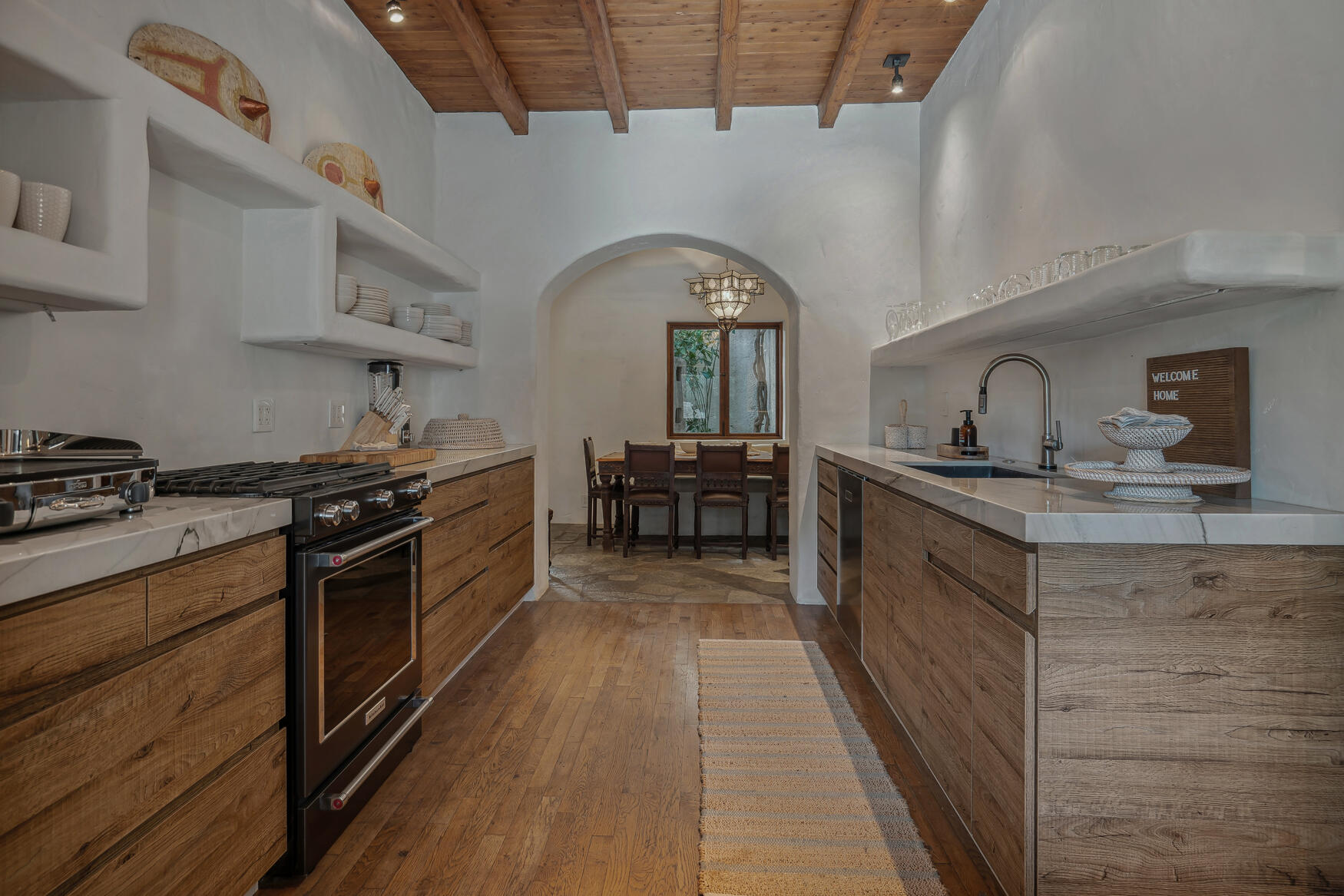 71607 Sahara Road Rancho Mirage, CA 92270 - Photo 24 of 63 a kitchen with stainless steel appliances granite countertop a stove and a sink