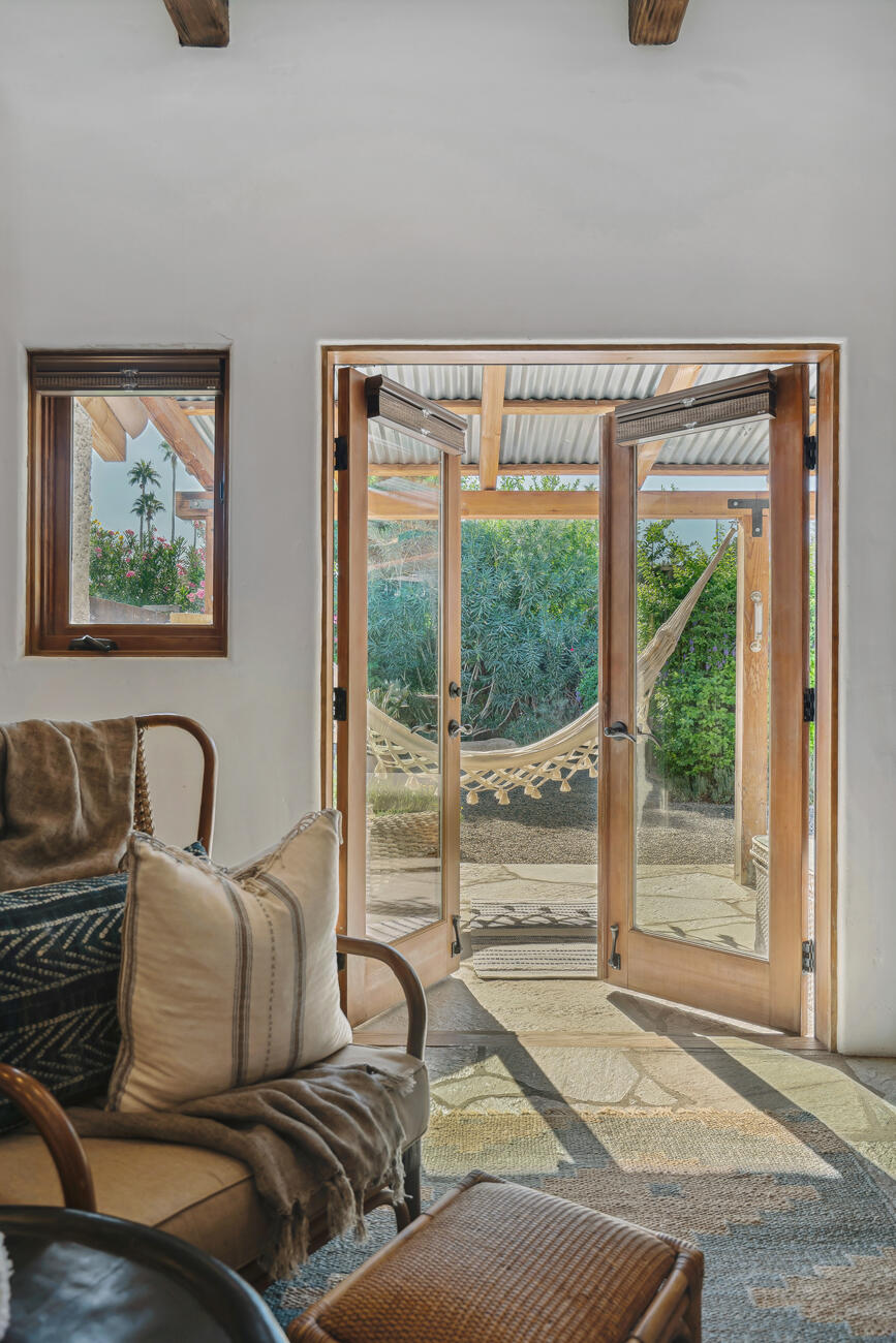 71607 Sahara Road Rancho Mirage, CA 92270 - Photo 29 of 63 a living room with furniture and a window