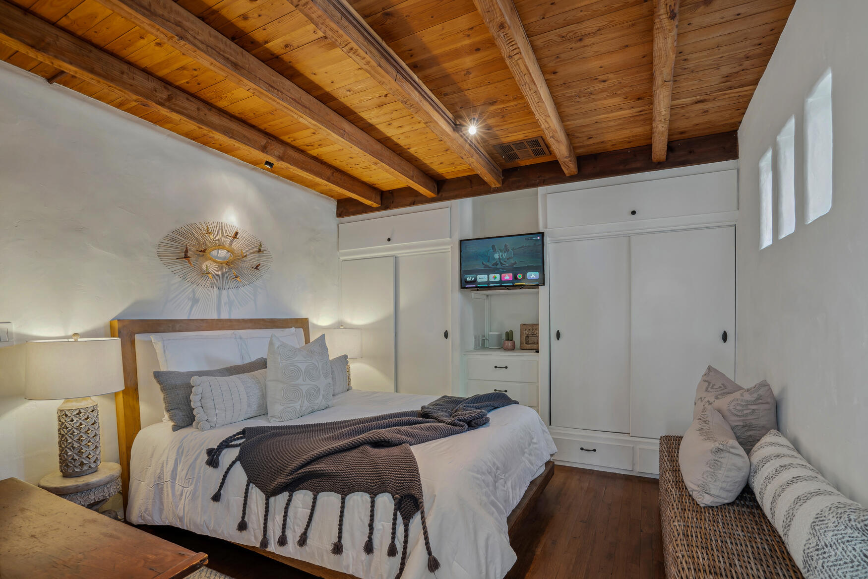 71607 Sahara Road Rancho Mirage, CA 92270 - Photo 42 of 63 a bedroom with a bed a couch and a chandelier