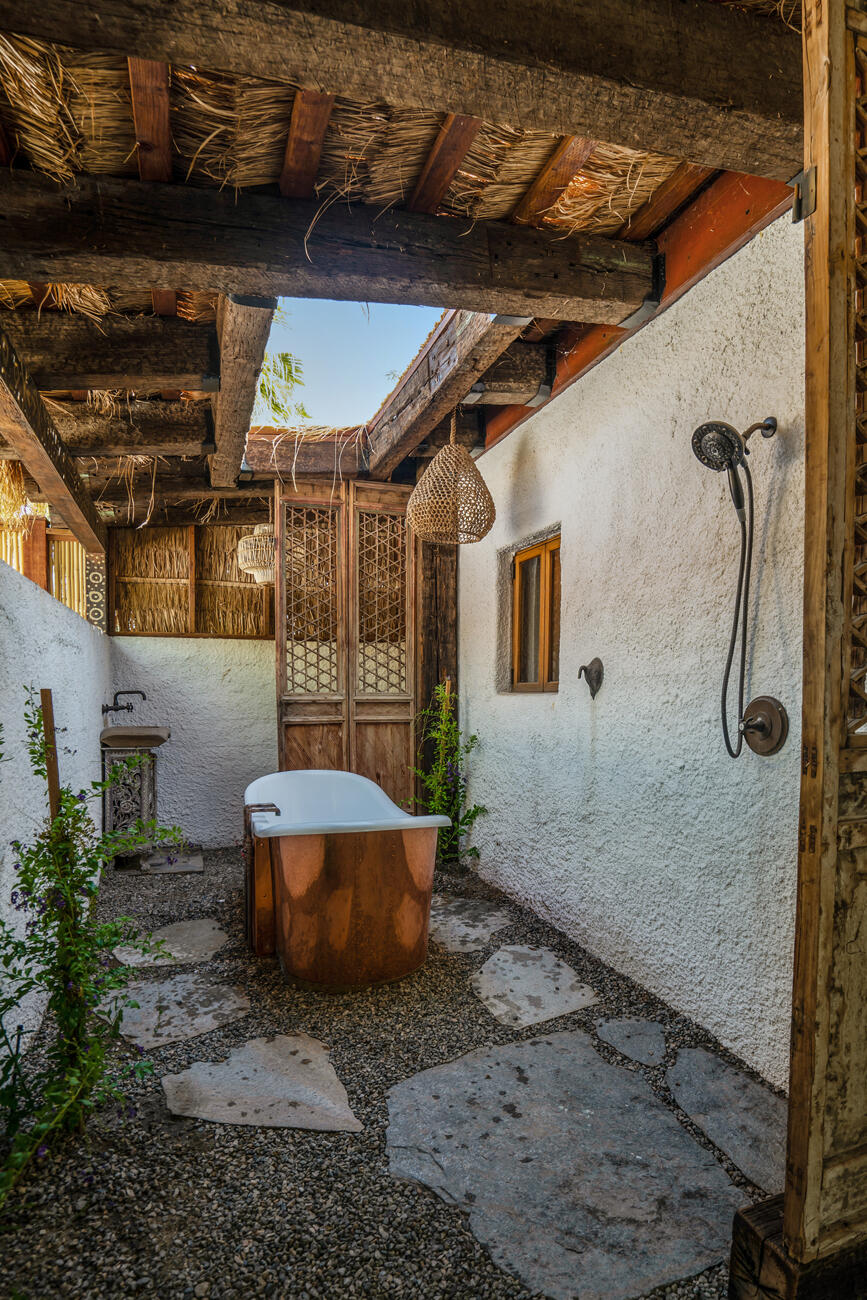 71607 Sahara Road Rancho Mirage, CA 92270 - Photo 49 of 63 a view of a porch with a table and chairs