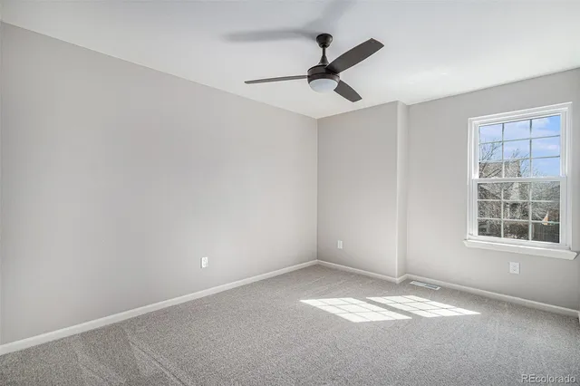 a view of empty room with windows