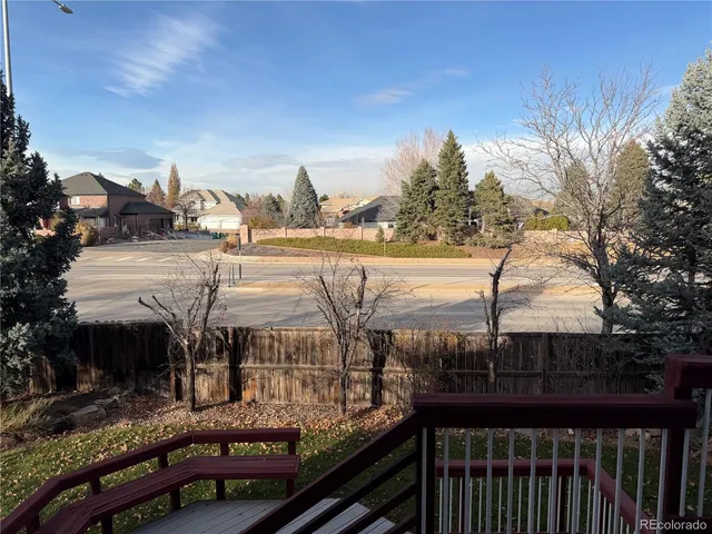 a view of a balcony with an outdoor seating