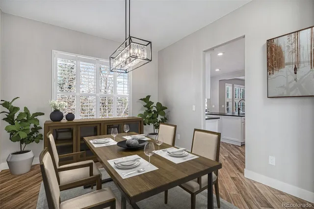 a view of a dining room with furniture window and wooden floor