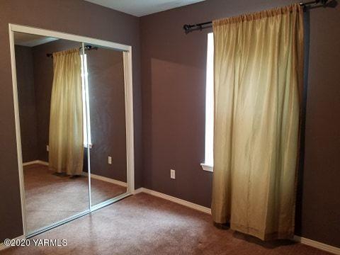 1920 South Euclid Road Grandview, WA 98930 - Photo 11 of 20 an empty room with window and closet
