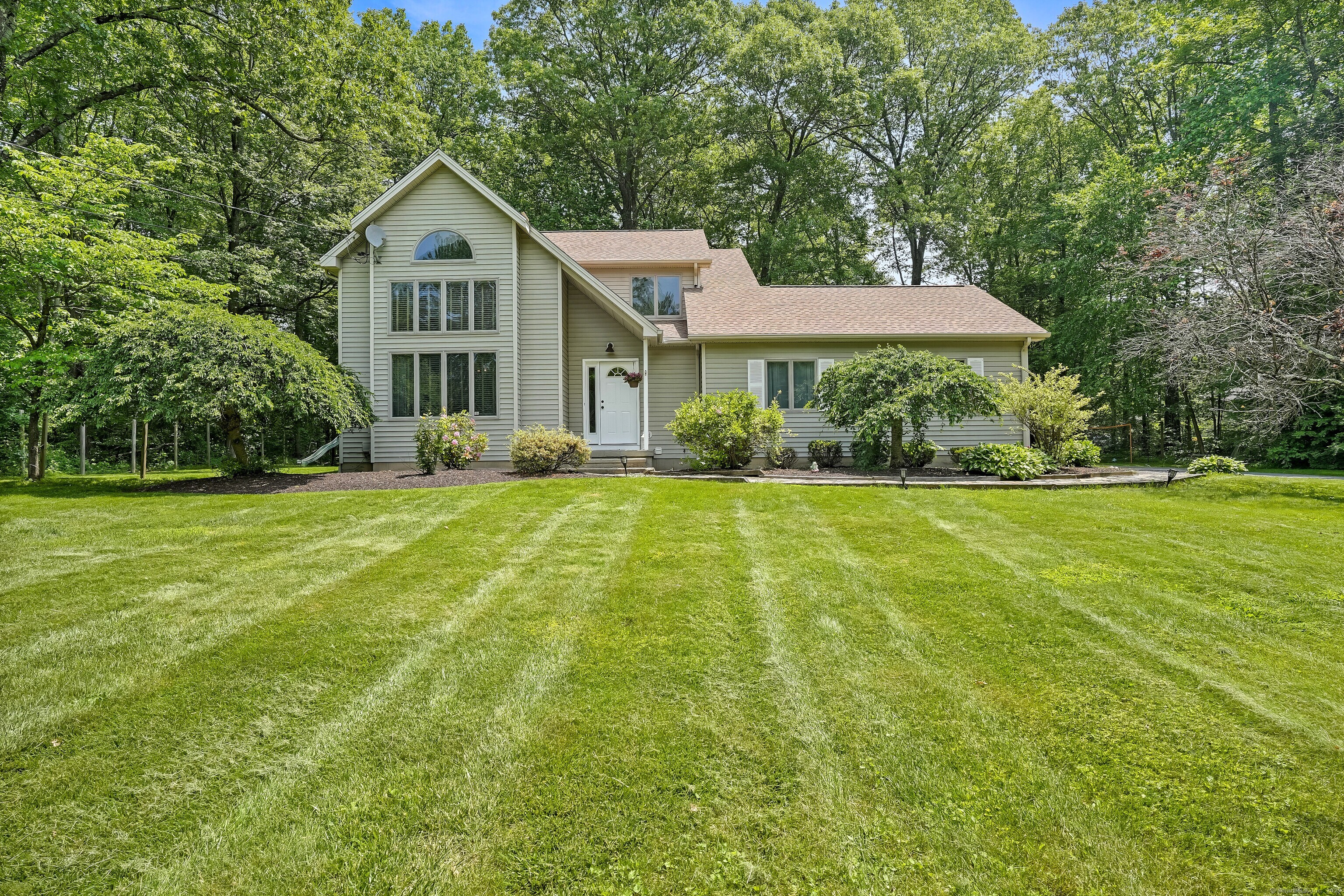 55 Carmen Hill Road Brookfield, CT 06804 - Photo 1 of 1 a front view of a house with yard and green space