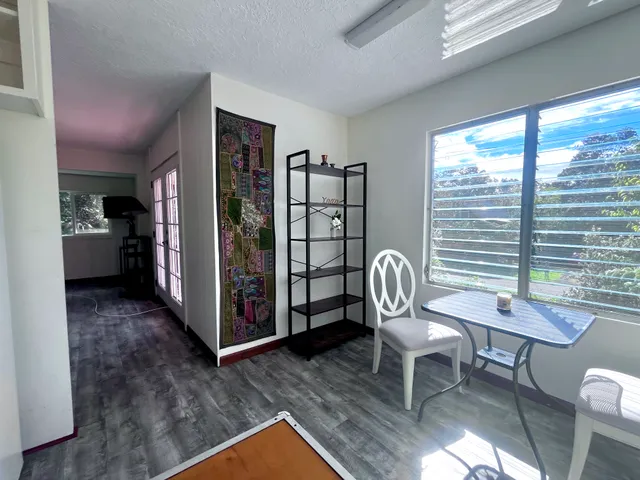 a view of a livingroom with furniture