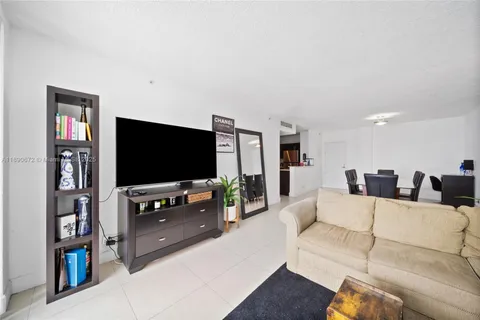 a bedroom with a bed and a large mirror