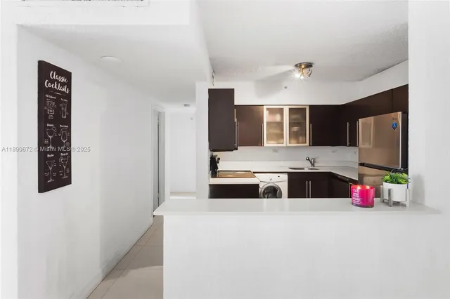 a kitchen that has a sink and a stove