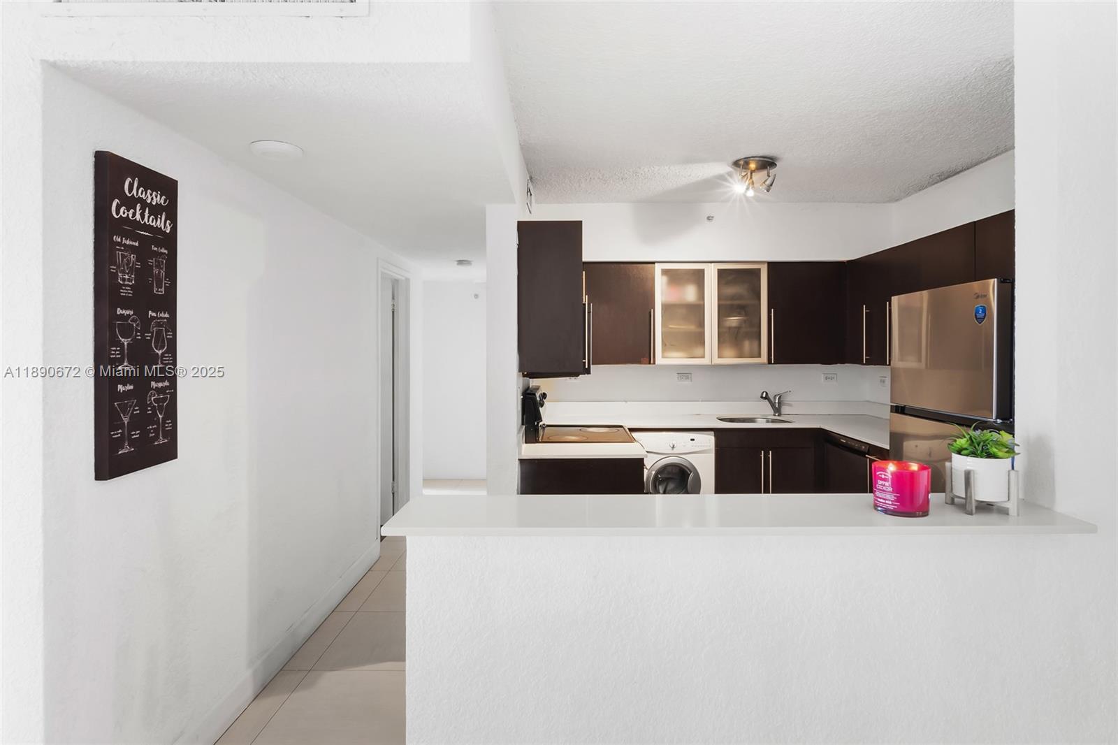 1500 Bay Road, Unit 1228S Miami Beach, FL 33139 - Photo 12 of 35 a bedroom with a bed and a large mirror