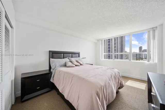 a bedroom with furniture and a dresser