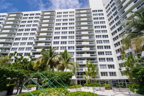 a view of a chair and tables in the patio