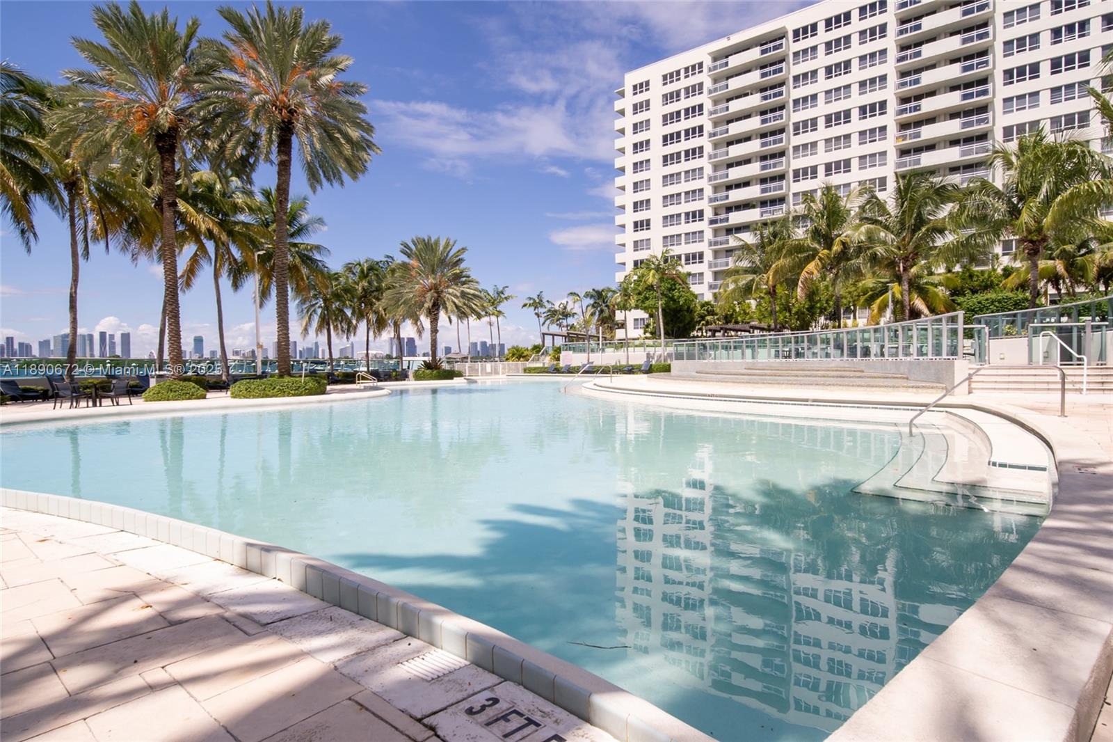 1500 Bay Road, Unit 1228S Miami Beach, FL 33139 - Photo 30 of 35 a swimming pool with outdoor seating and yard