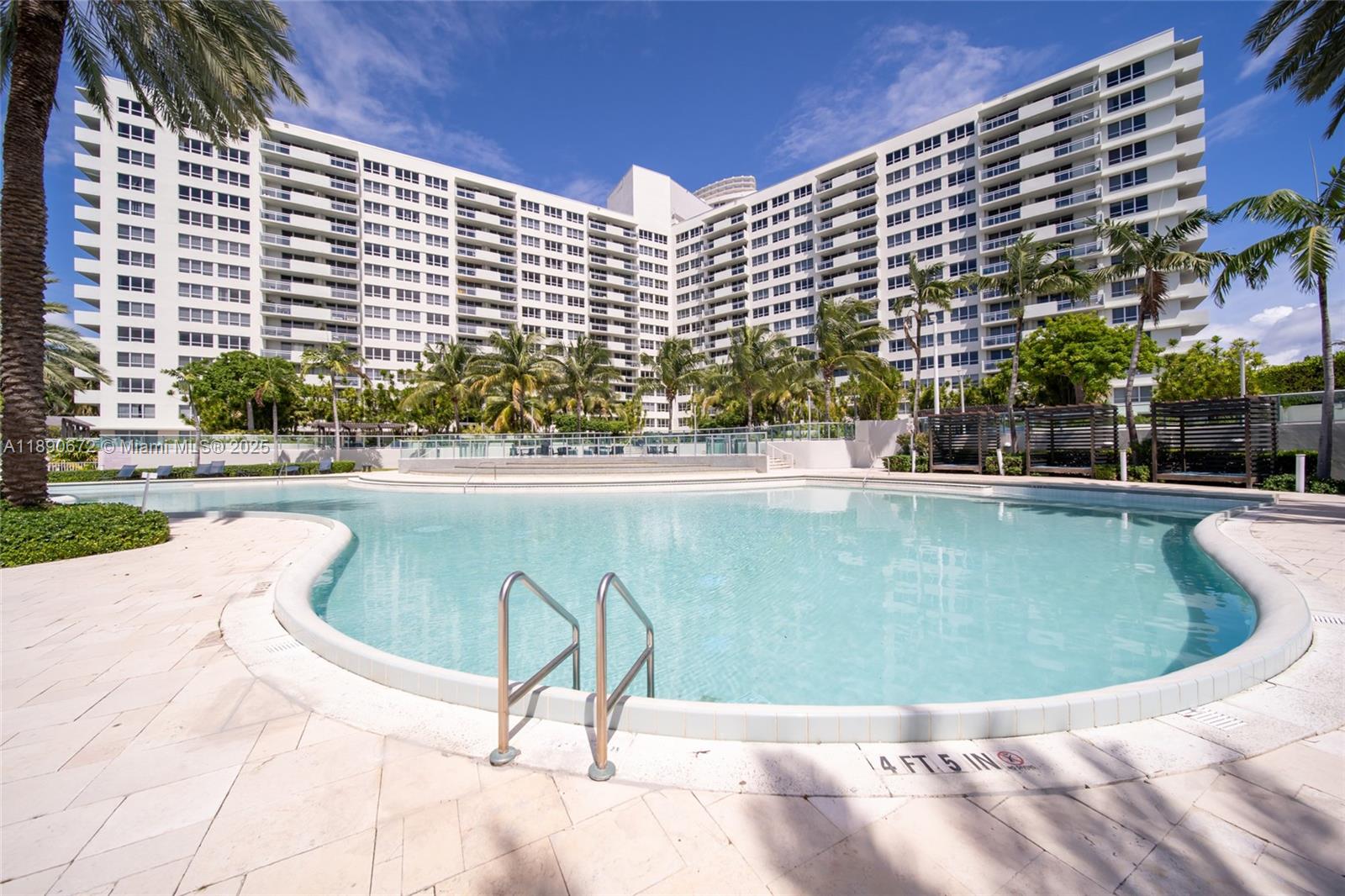 1500 Bay Road, Unit 1228S Miami Beach, FL 33139 - Photo 31 of 35 a view of swimming pool with outdoor seating and plants