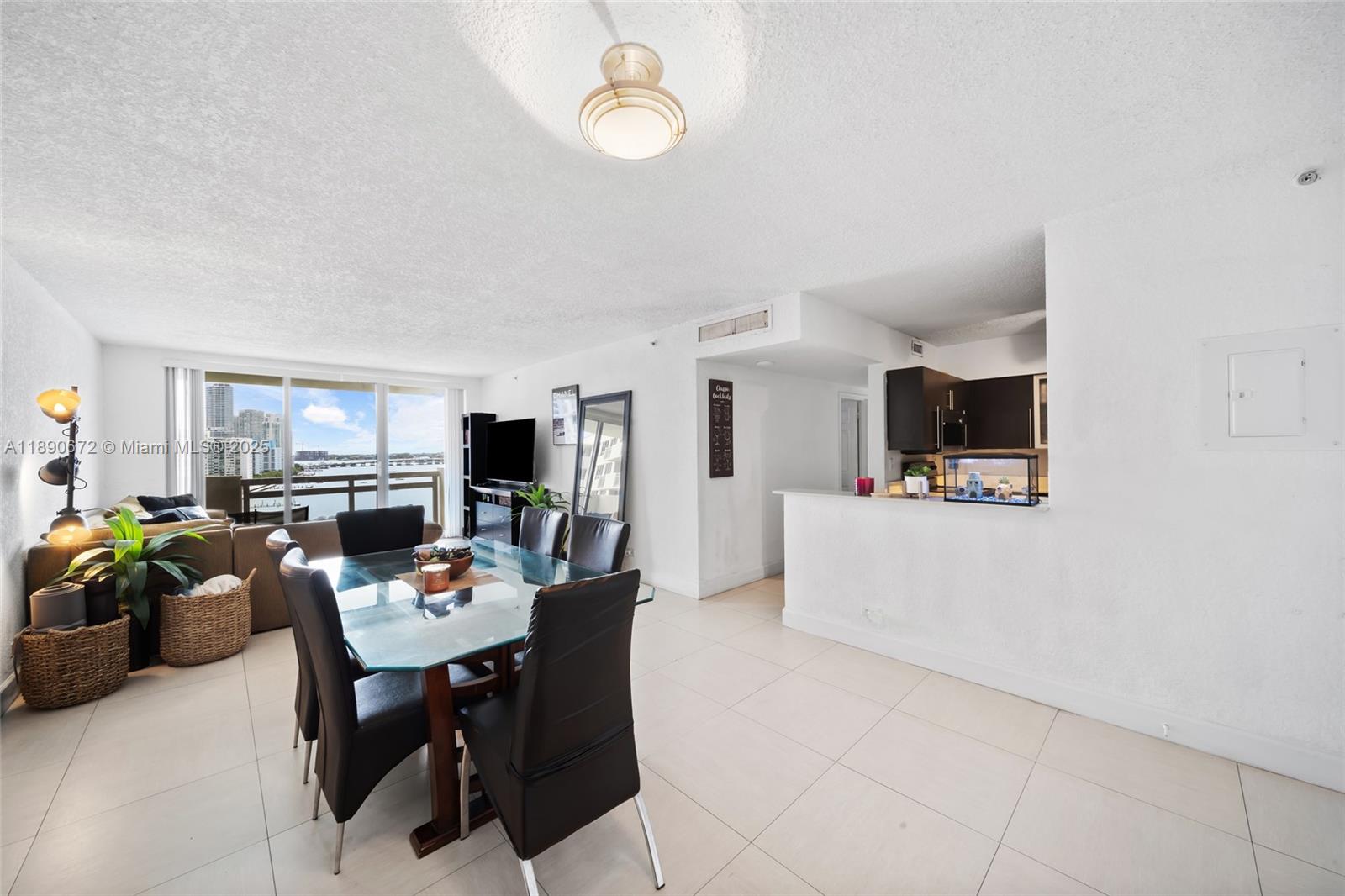 1500 Bay Road, Unit 1228S Miami Beach, FL 33139 - Photo 5 of 35 a view of a dining room with furniture