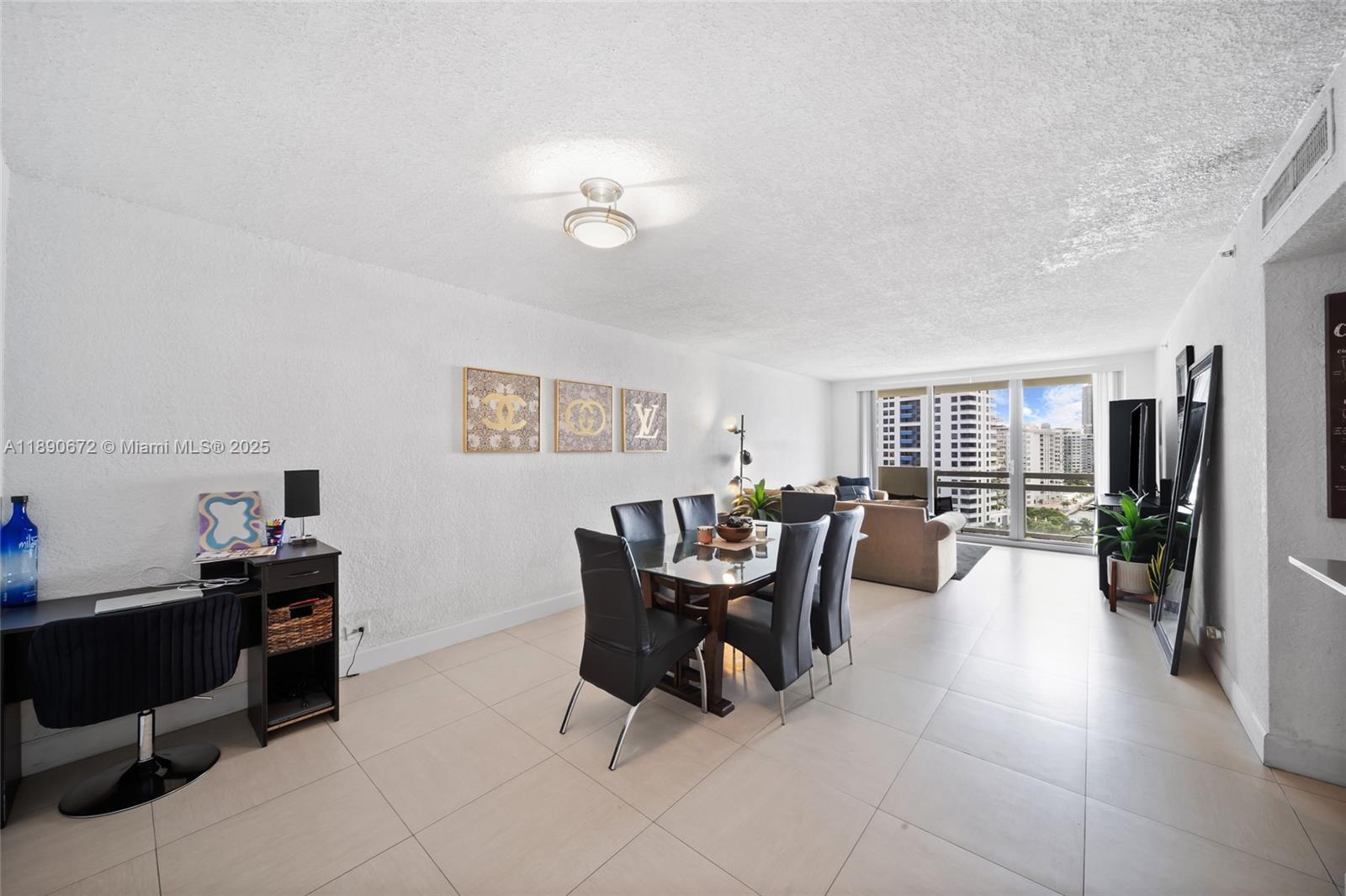 1500 Bay Road, Unit 1228S Miami Beach, FL 33139 - Photo 7 of 35 a living room with furniture and a window