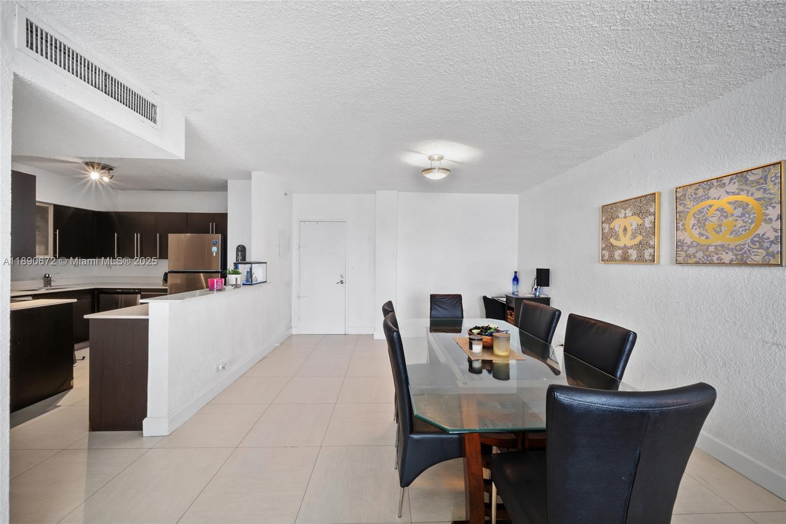 1500 Bay Road, Unit 1228S Miami Beach, FL 33139 - Photo 9 of 35 a view of a dining room with furniture and a kitchen