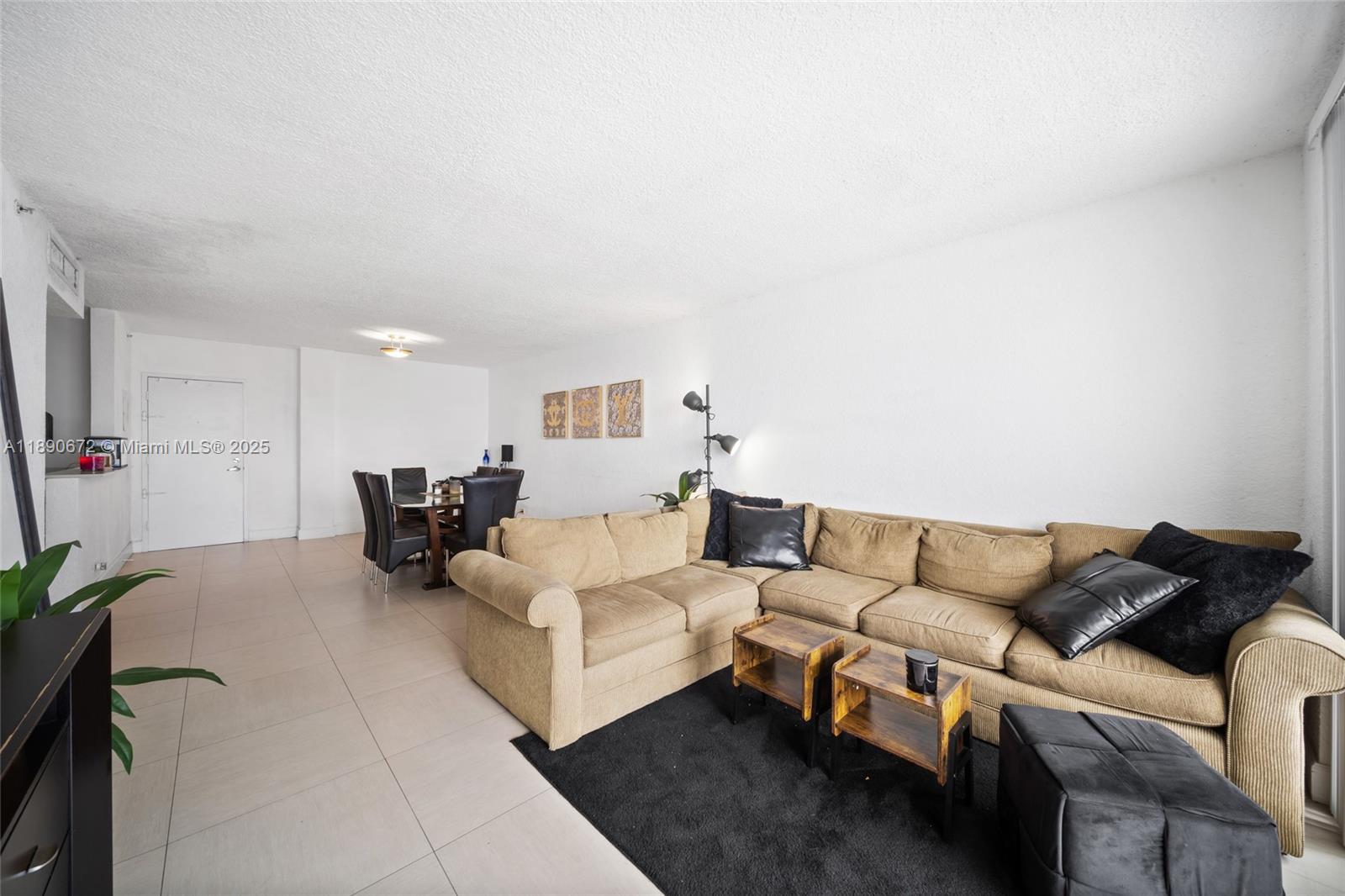 1500 Bay Road, Unit 1228S Miami Beach, FL 33139 - Photo 10 of 35 a living room with furniture and a couch
