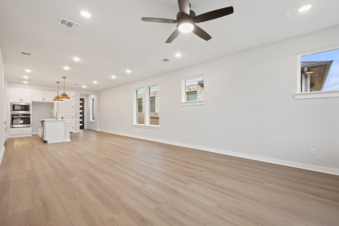 204 Bloomington Loop Hutto, TX 78634 - Photo 13 of 37 a view of empty room with wooden floor and window