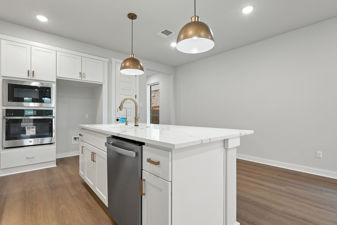 204 Bloomington Loop Hutto, TX 78634 - Photo 20 of 37 a kitchen with a sink and a stove
