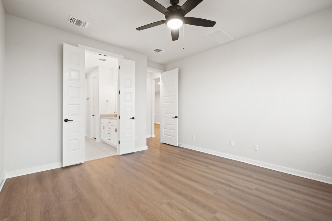 204 Bloomington Loop Hutto, TX 78634 - Photo 23 of 37 wooden floor in an empty room