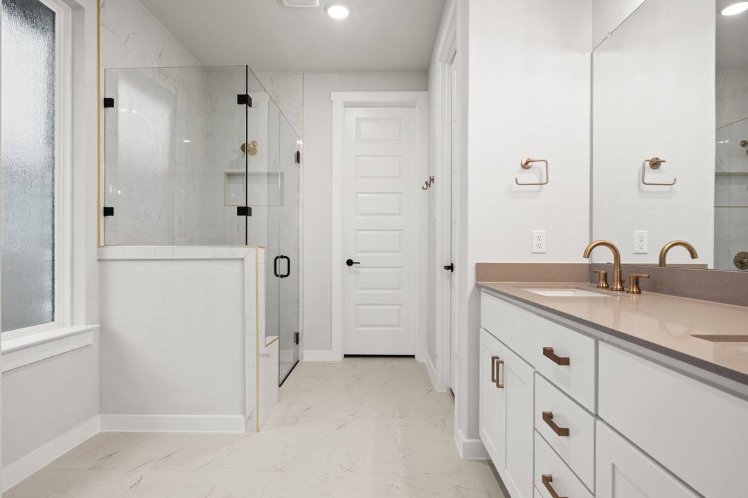 204 Bloomington Loop Hutto, TX 78634 - Photo 24 of 37 a bathroom with a granite countertop sink two mirror and shower
