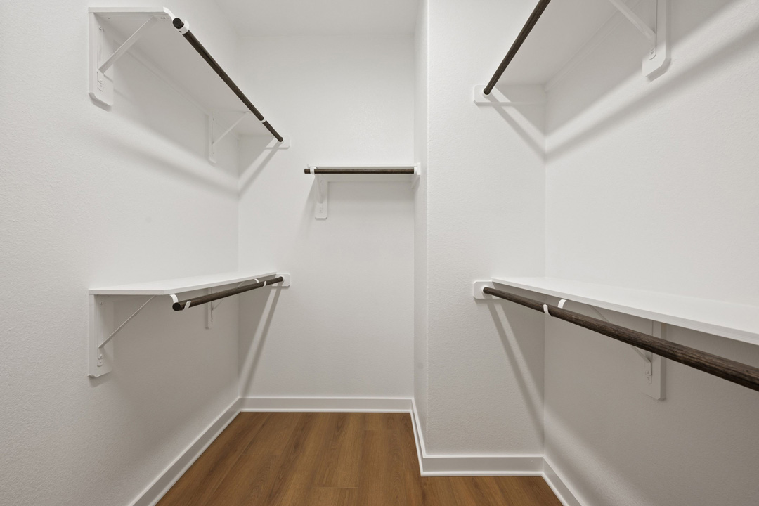 204 Bloomington Loop Hutto, TX 78634 - Photo 27 of 37 a view of walk in closet with empty racks