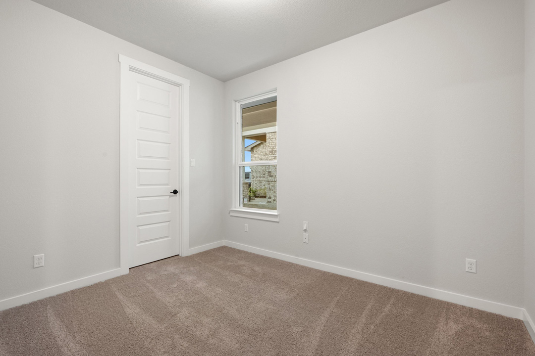 204 Bloomington Loop Hutto, TX 78634 - Photo 30 of 37 an empty room with windows