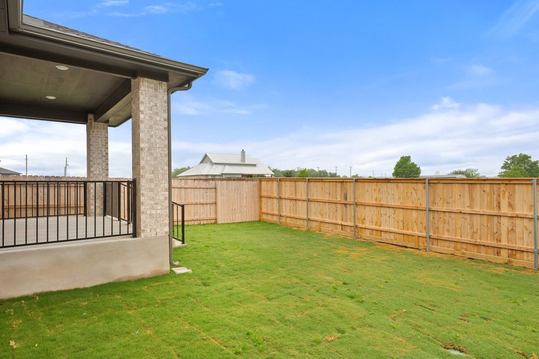 204 Bloomington Loop Hutto, TX 78634 - Photo 35 of 37 a view of a backyard with mountain view and ocean view