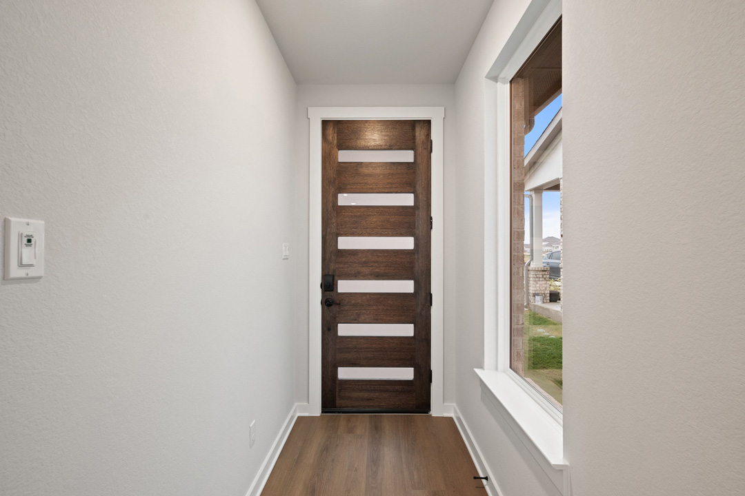 204 Bloomington Loop Hutto, TX 78634 - Photo 6 of 37 a view of walk in closet with empty racks