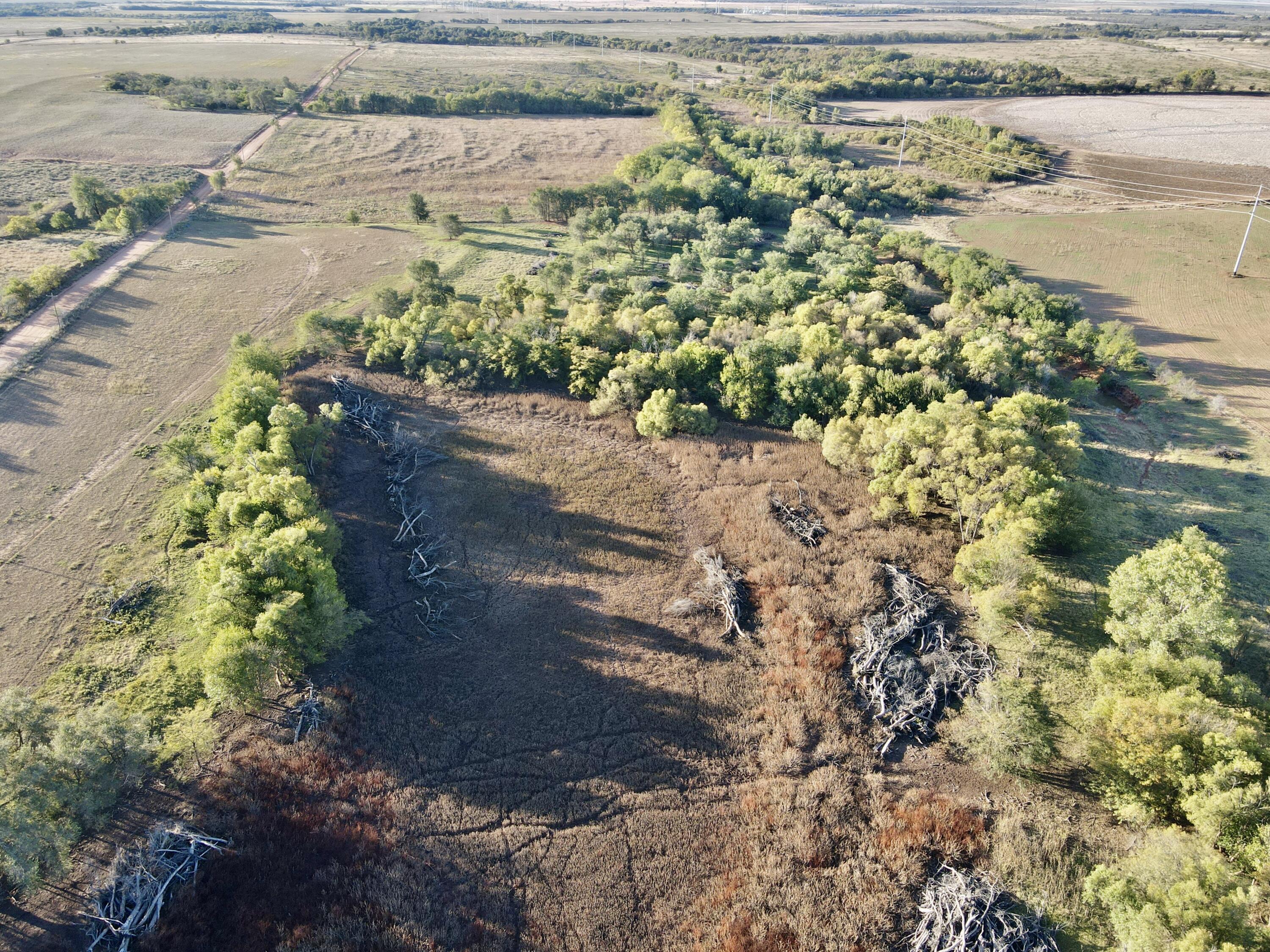 5 115 /- Acres State Highway Turkey, TX 79261 - Photo 6 of 28 a view of a lake with beach