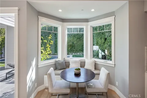 a dining room with furniture window and outside view