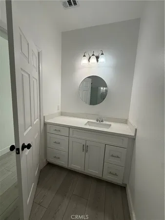 a bathroom with a double vanity sink and mirror