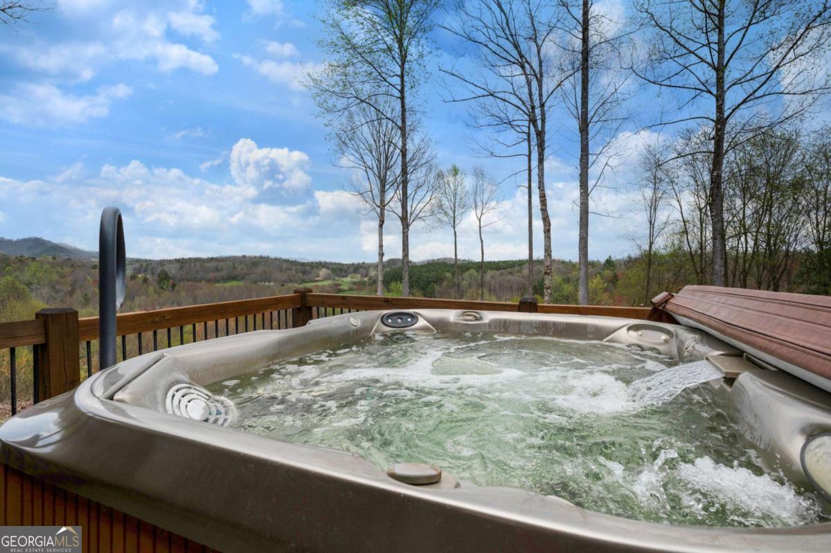 136 Pack Creek Road Blue Ridge, GA 30513 - Photo 26 of 62 a view of a swimming pool with a patio