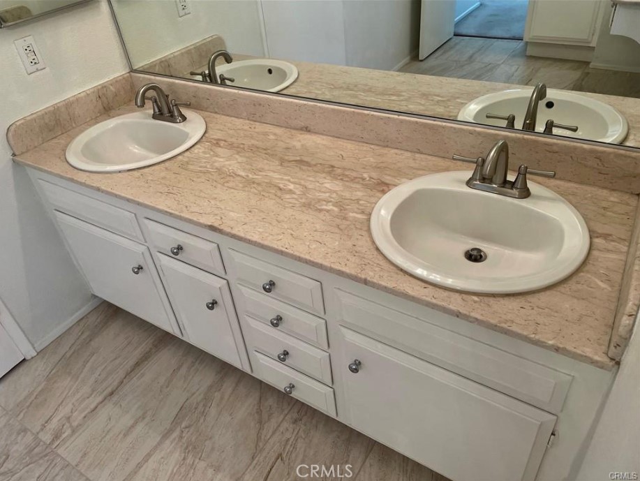 3217 Topaz Lane Fullerton, CA 92831 - Photo 15 of 23 a bathroom with double sink and a mirror